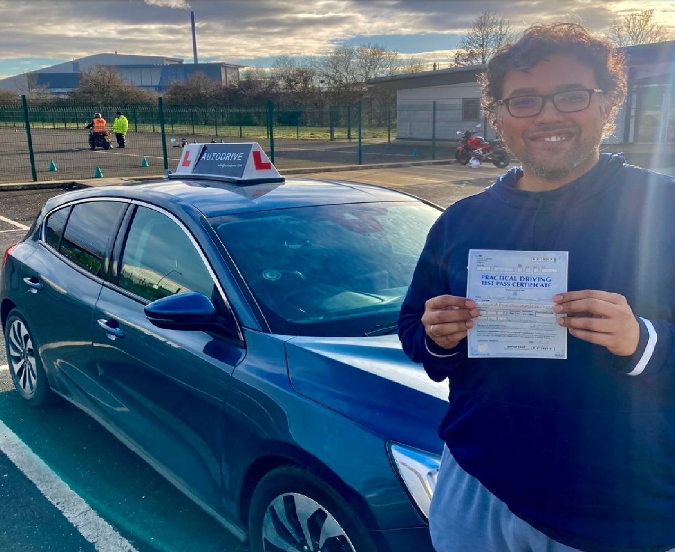 Avadhut K. holding his practical driving test pass certificate