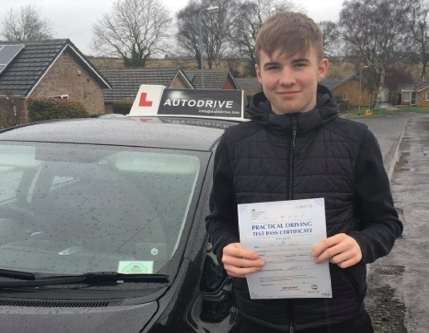 Glen M. holding his practical driving test pass certificate