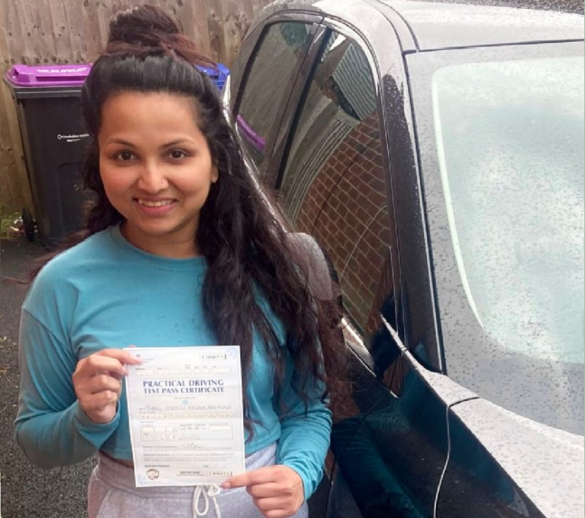 Thanuji S. holding her practical driving test pass certificate